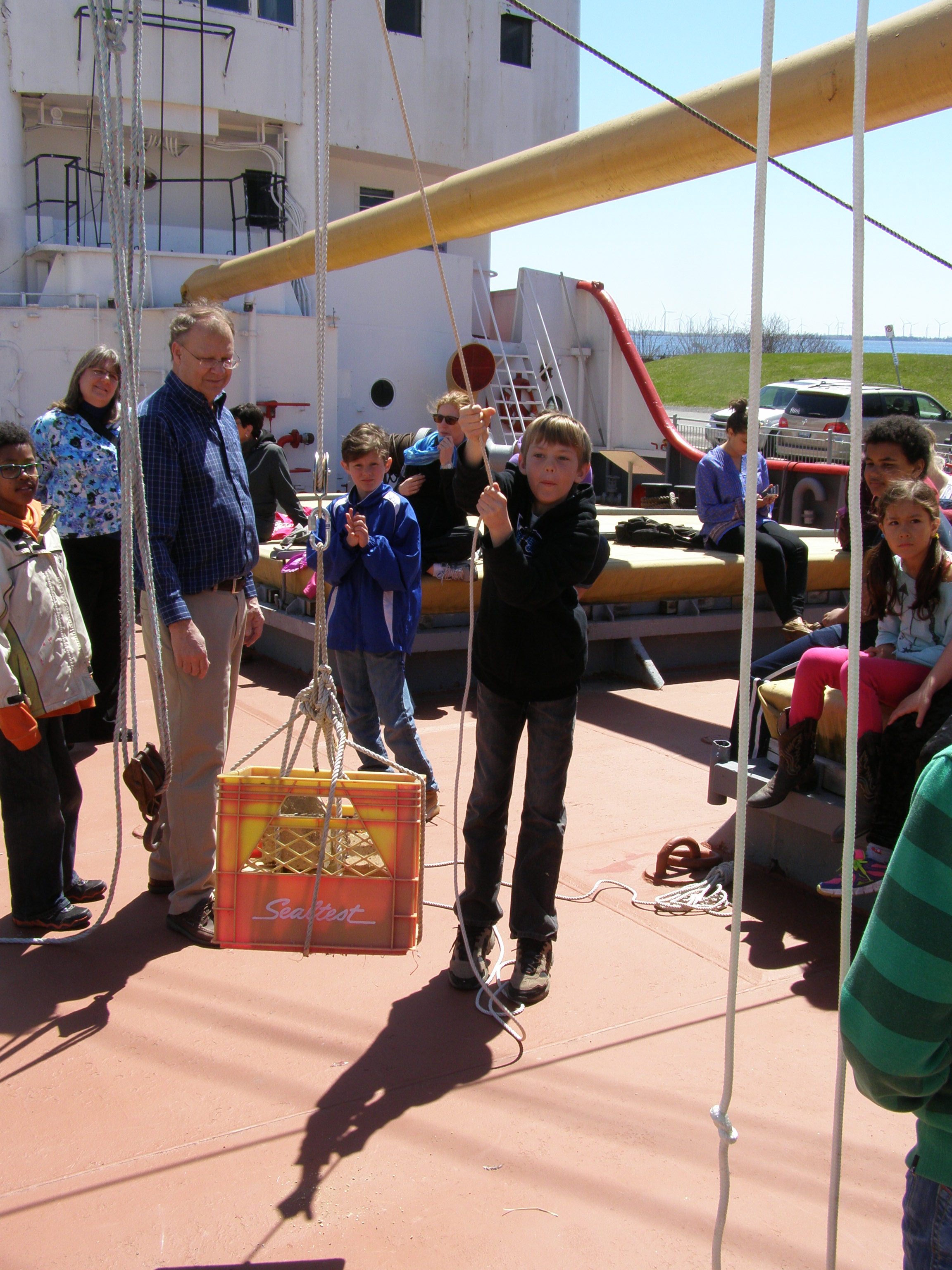 Student learns about pulleys at Marine Museum of the Great Lakes