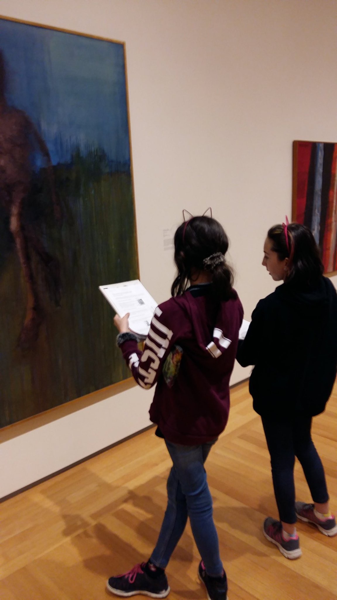 Students reflecting on artworks at the Agnes